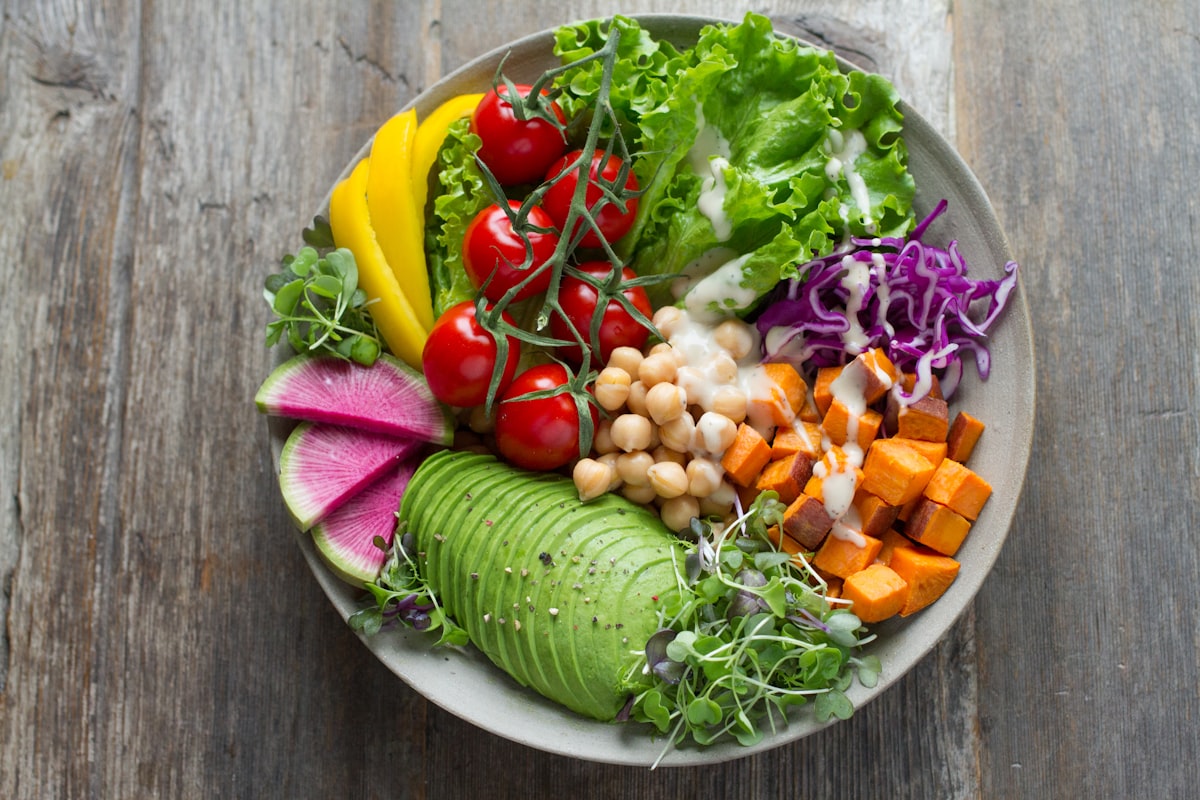 Colorful healthy meal bowl with avocado, vegetables, and chickpeas
